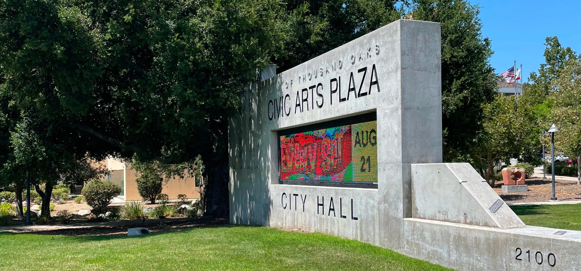 Civic Arts Plaza City Hall sign outdoors.