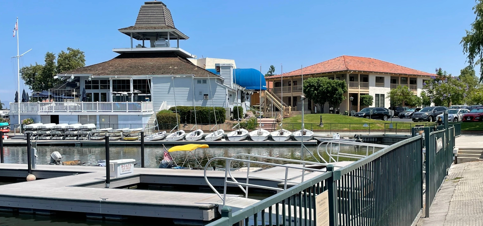 Marina with boats and waterfront buildings.